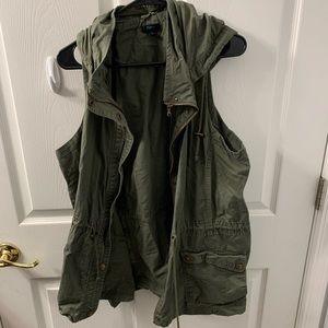 Green denim material vest.